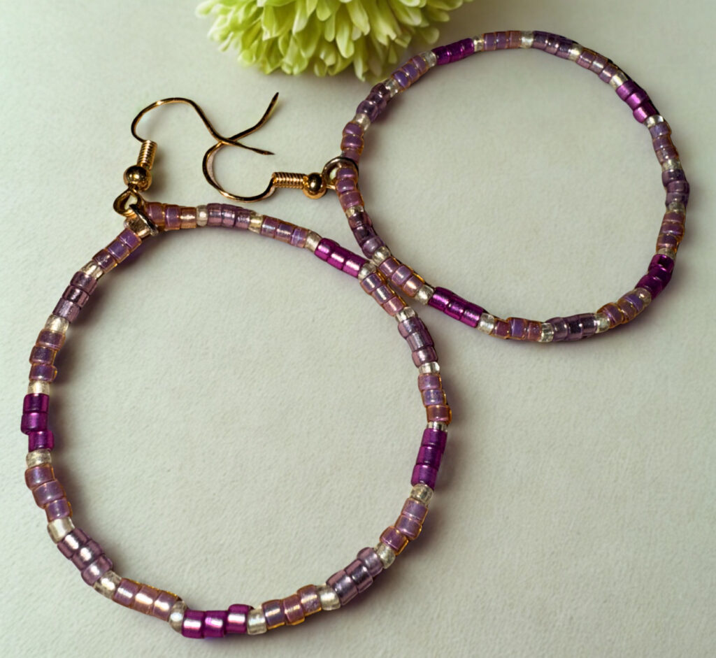 Purple and gold alternating beaded earrings.