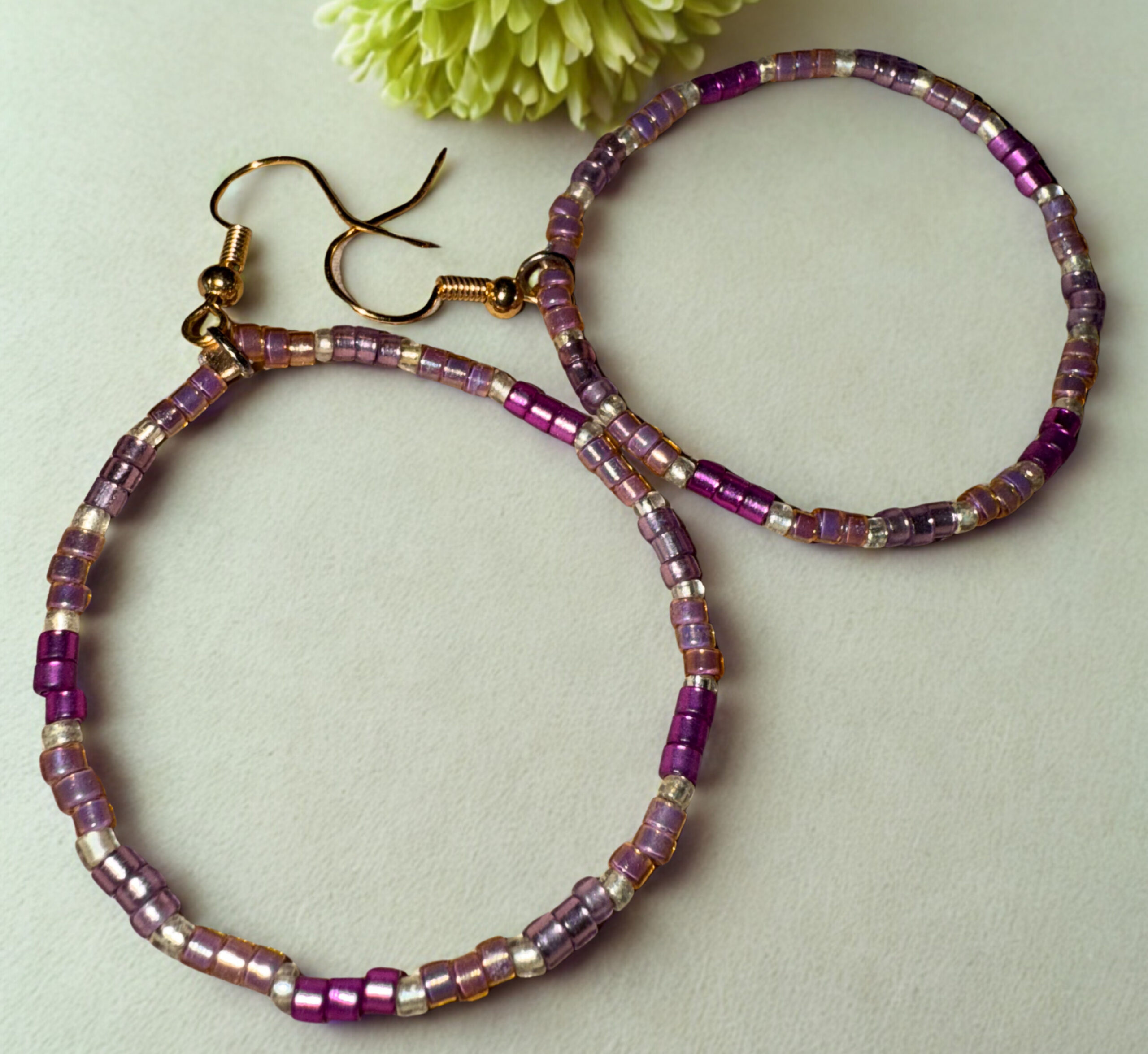 Purple and gold alternating beaded earrings.