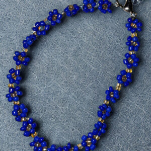 Small bracelet made with navy flower beads and a lobster claw clasp.