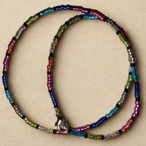 Medium length necklace, 16 inches with multicolored and black beading and a lobster claw clasp.