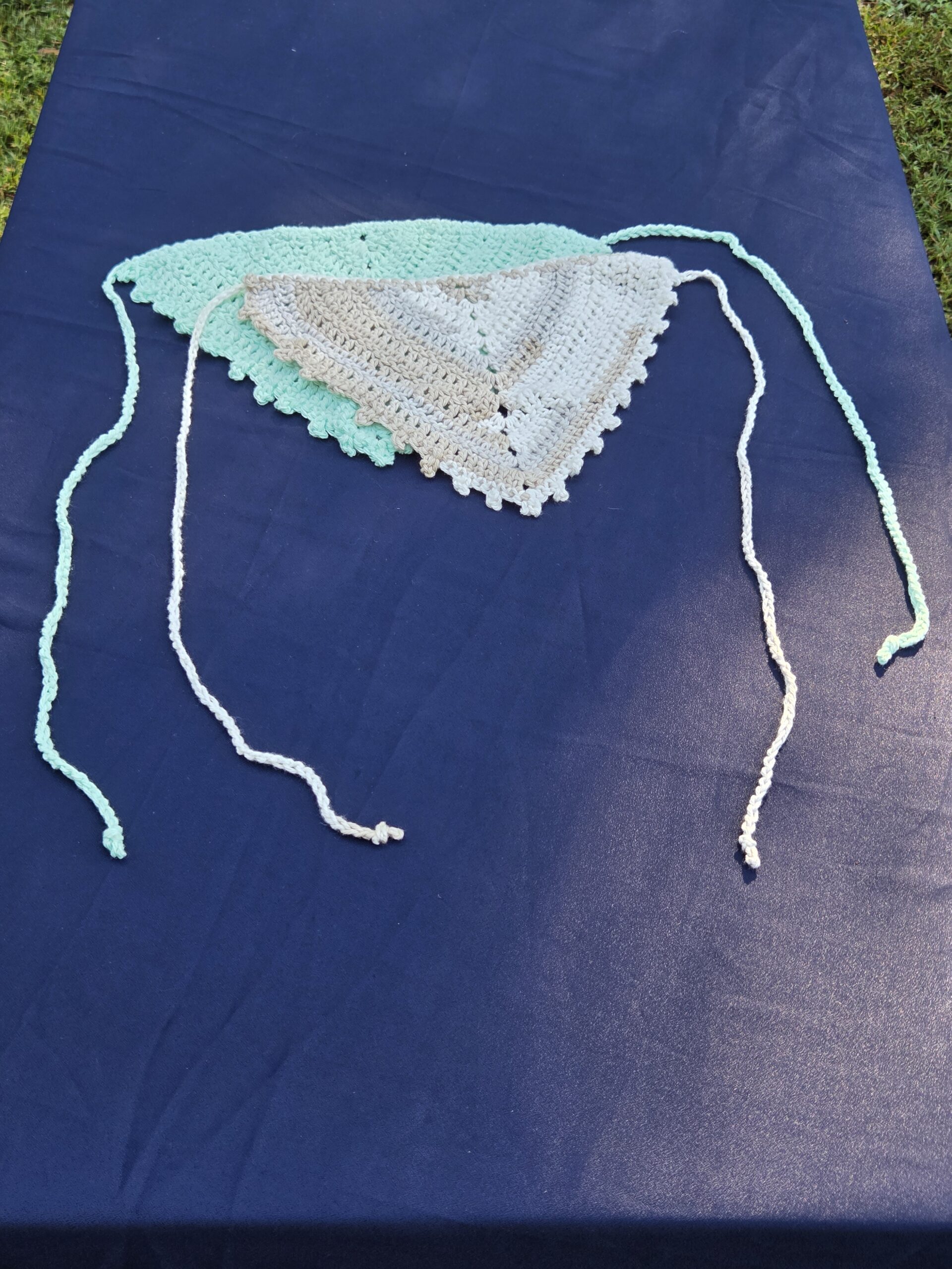 2 headscarves. One teal, one white and tan. Crochet, handmade. 10 1/2 by 8 inches.