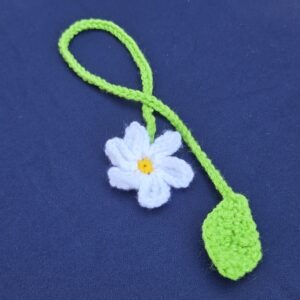 White flower bookmark, crochet, with yellow pistil. Cord and leaf in grassy green.