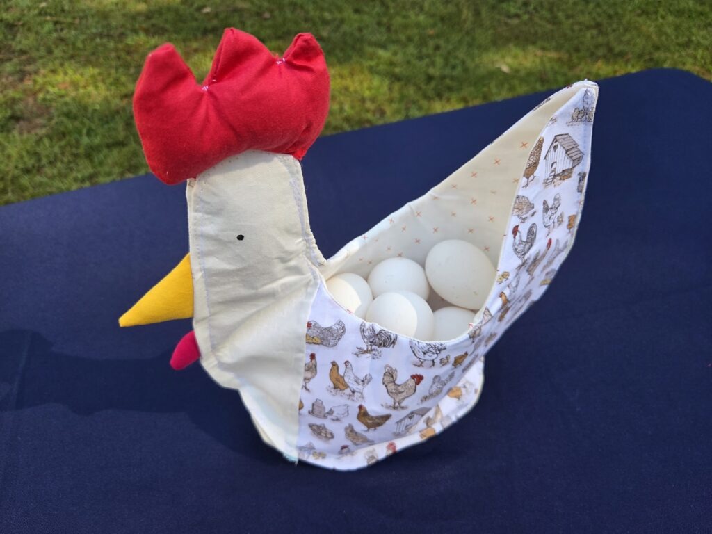 Chicken shaped basket holds up to a dozen eggs. Lays flat when not in use for easy storage.