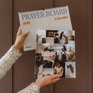 Hands holding Prayer Board Calendar and Image Book