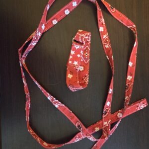 Small dog collar with matching leash in red bandanna fabric with Velcro closure.