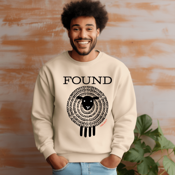 Smiling man wearing FOUND sweatshirt