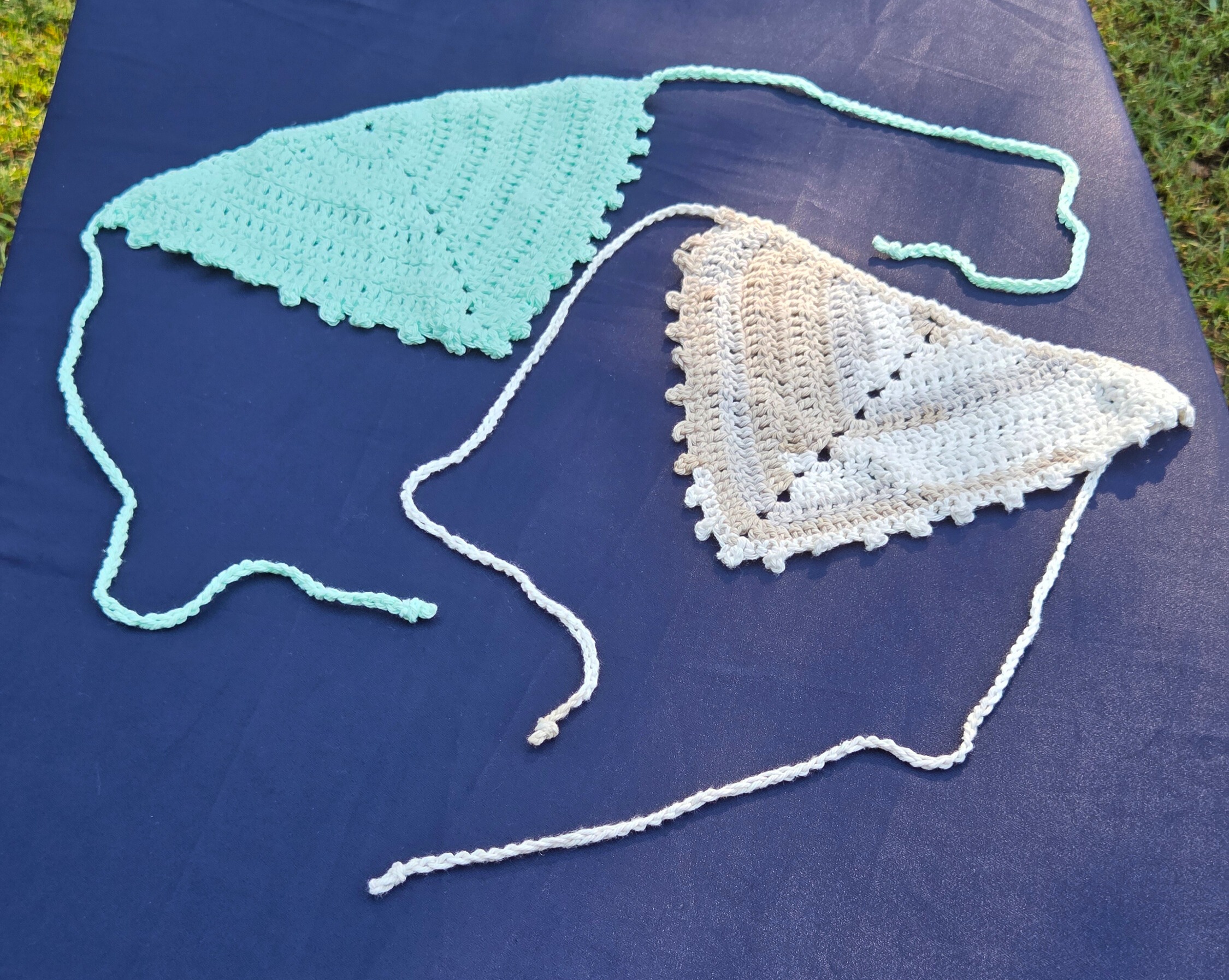 Set of 2 crochet head scarves. One light teal, one tan and white.