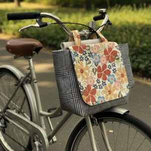 Messenger Bag for stroller, bicycle, walker, etc. Neutral floral and black and white plaid design. Fully lined. Attaches via hook-and-loop tape strap (Velcro).