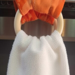 Kitchen towel hanger in orange.