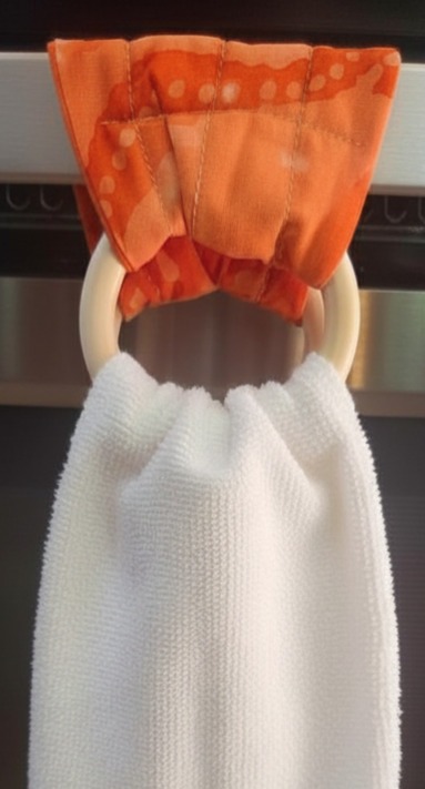 Kitchen towel hanger in orange.