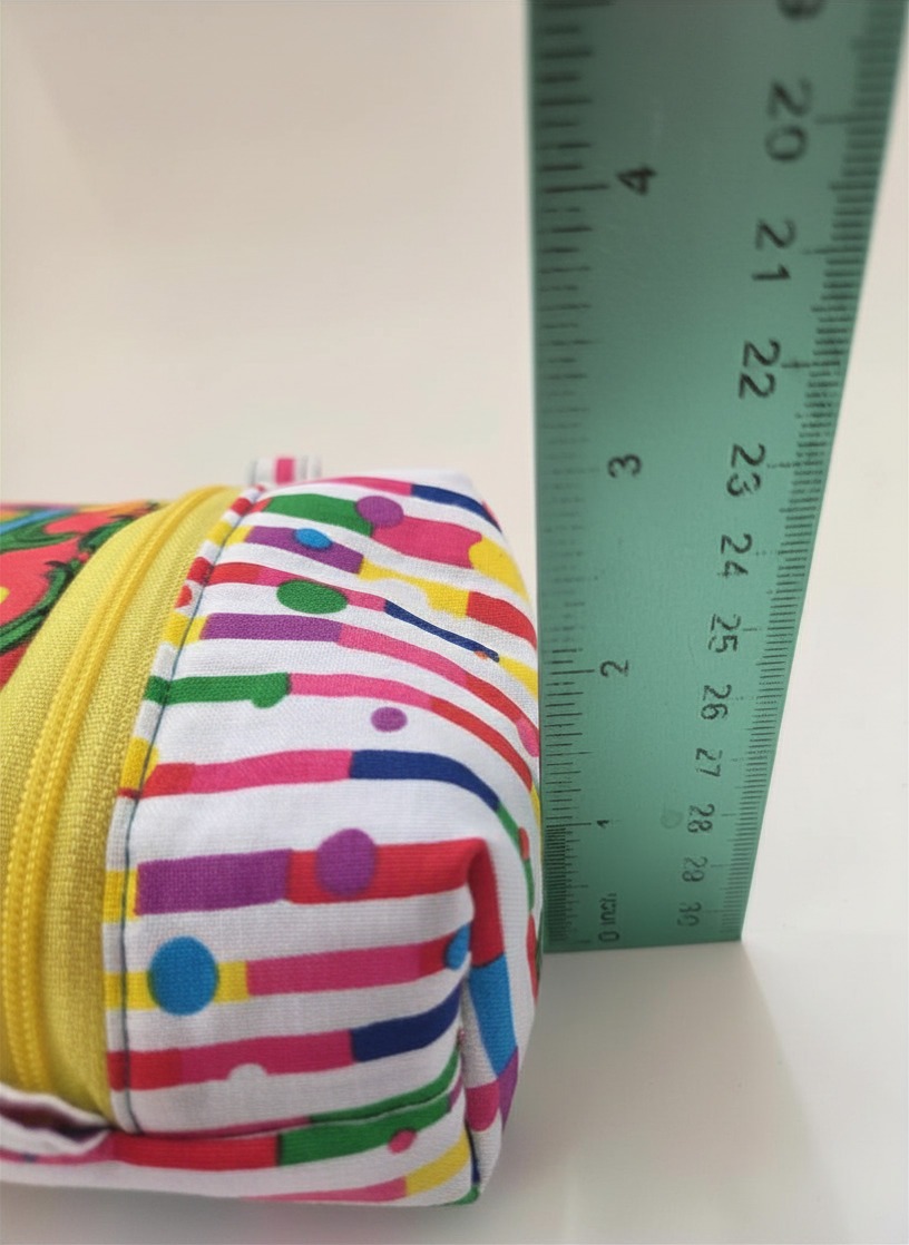 Brightly colored pacifier pouch is handmade and fully lined. Zipper closure.