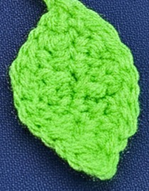 Delicate bright green leaf detail shown on the end of the bookmark.