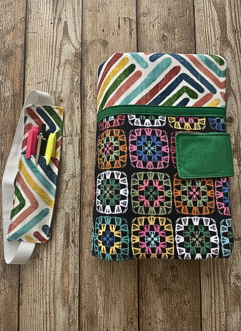 Bible case in jeweltone colors features geometric pattern on the top and crocheted squares on the bottom. Sturdy upholstery fabric; handmade.