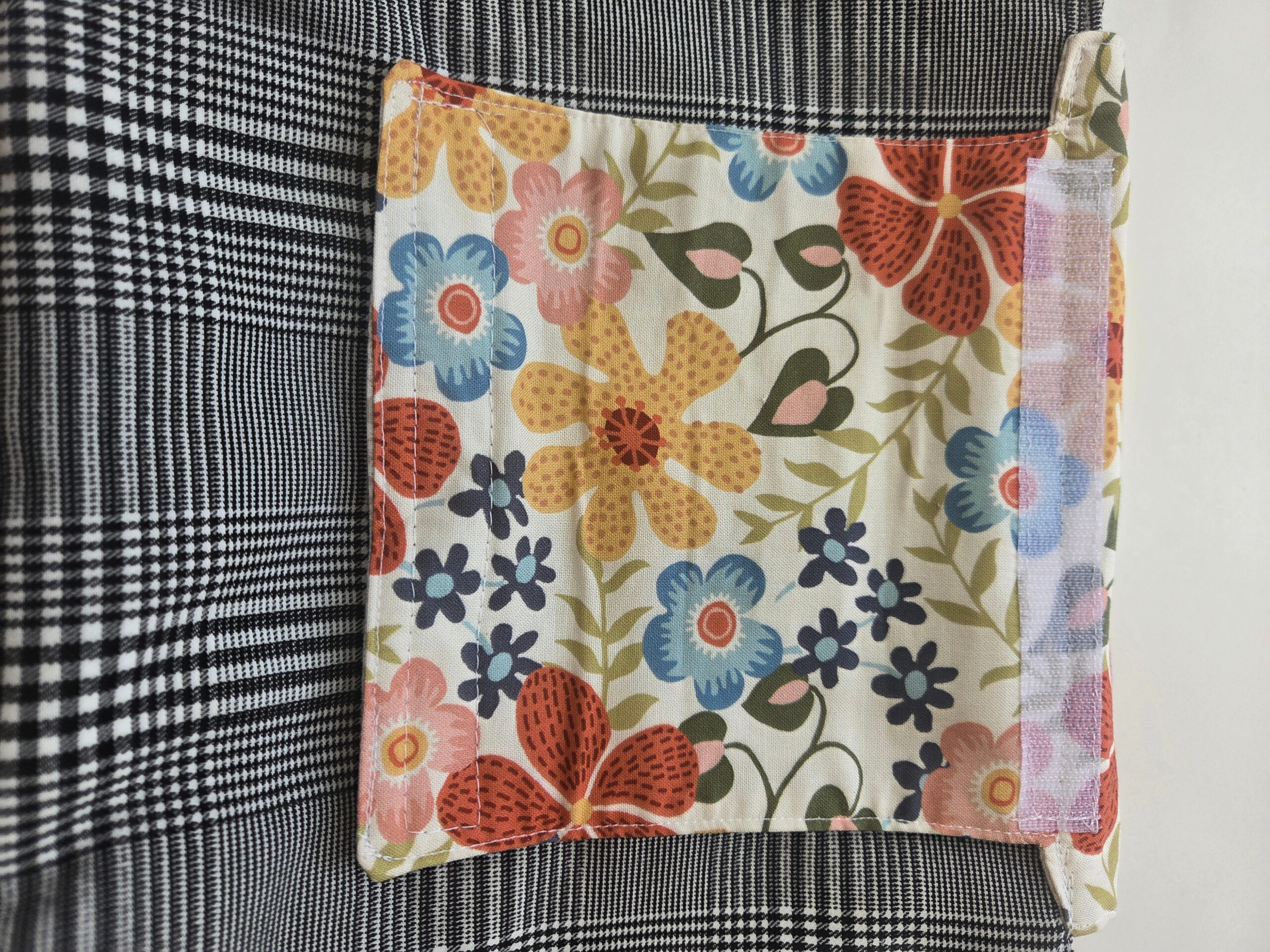 Shown: floral pattern lining of strap that attaches to the bar (bicycle, stroller, walker, etc.)