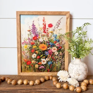 Wildflower artwork sitting on a shelf with other decorations