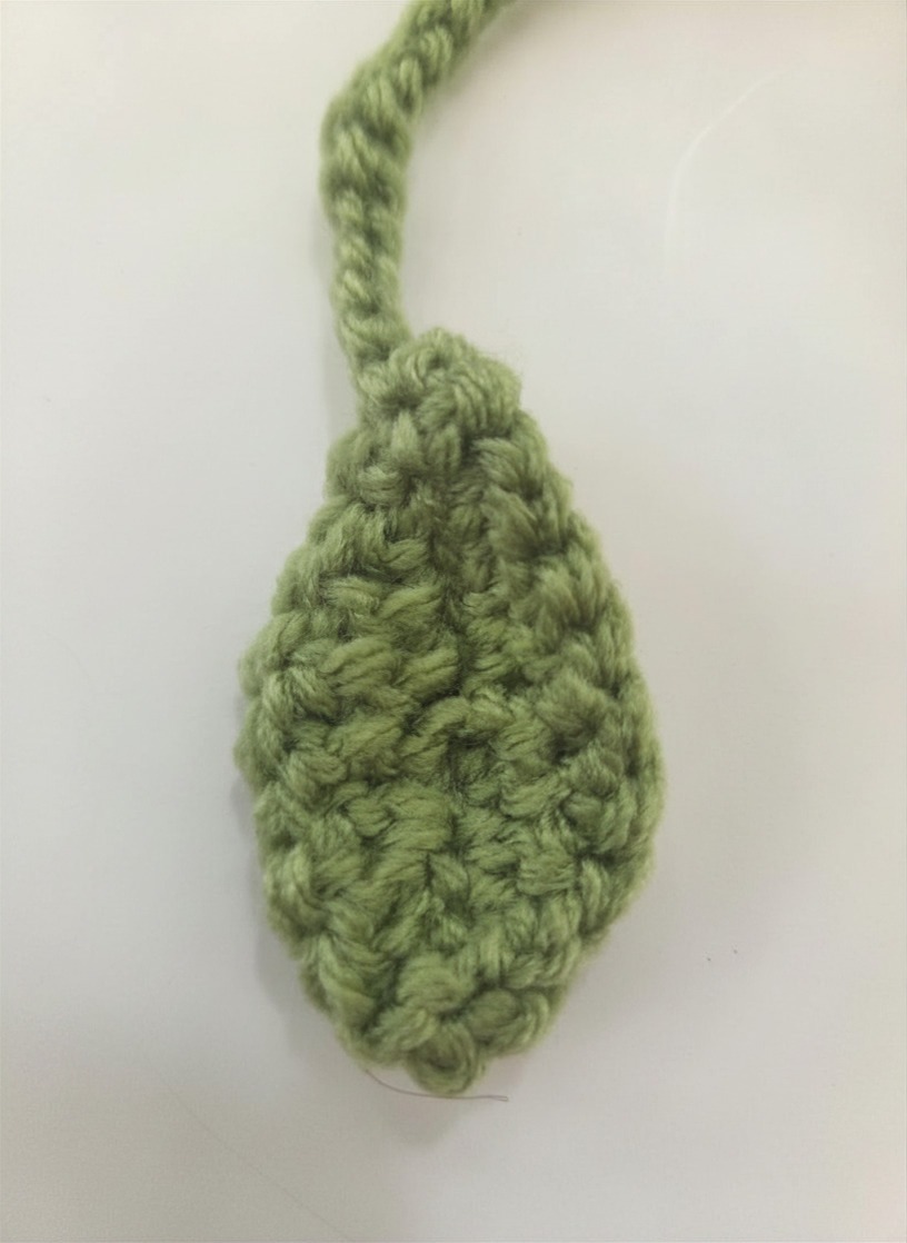 Sunflower bookmark features details including lovely yellow petals and a tiny green leaf at the end.