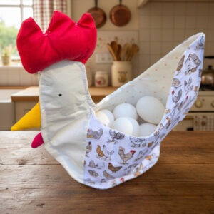 Egg basket made to look like a chicken, with chicken print. Holds up to a dozen eggs.