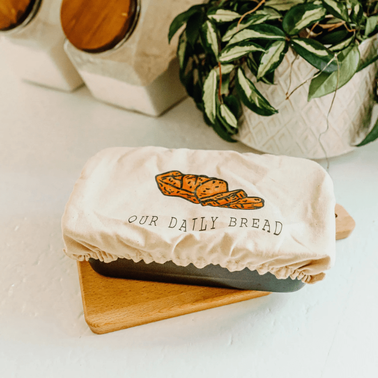Loaf Cover by Lori's Sweet Treasures placed over a bread pan sitting on counter