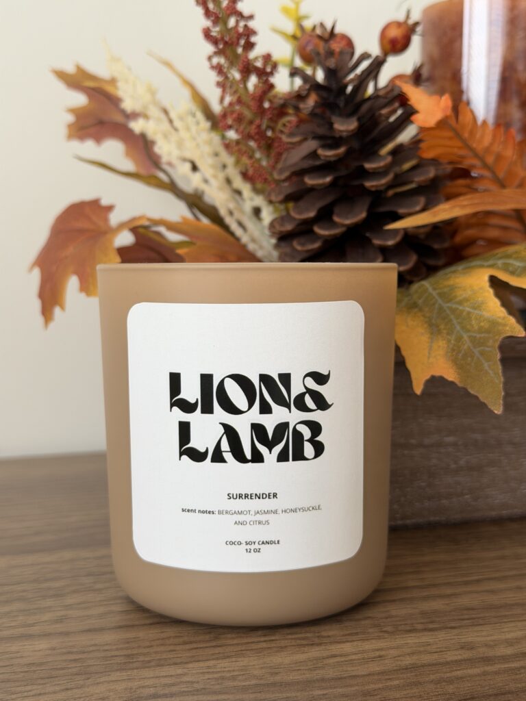 12 oz Surrender coco-soy candle with a wooden wick in a khaki jar